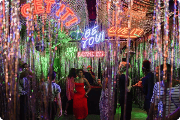 A neon dance club installation by Refinery29 at the 29Rooms Annual Exhibition
