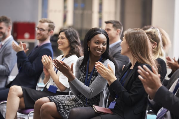 A round of applause at a conference award ceremony