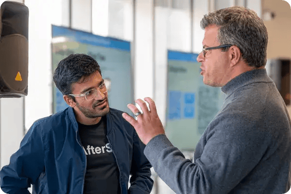 Two male attendees networking with Jam Bingo in Calgary, AB