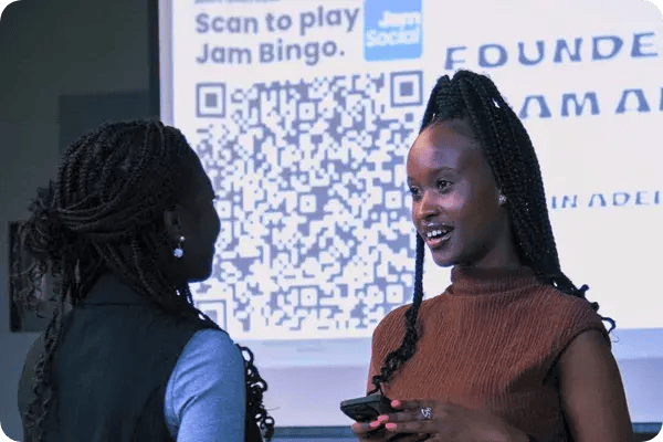 Two women playing Jam Bingo at an event in Edmonton, AB