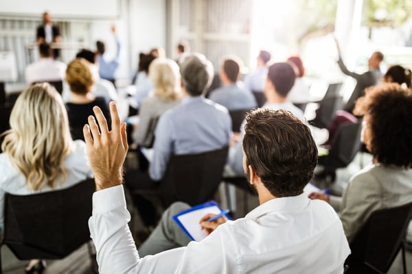 Attendees participate in a breakout session