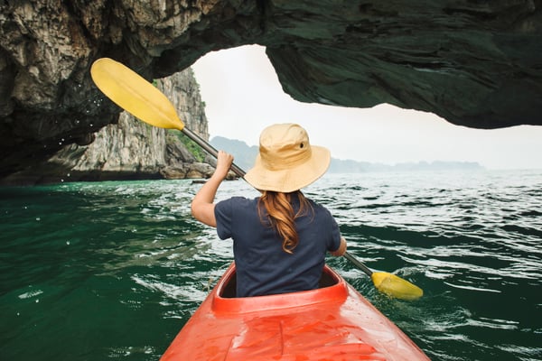 Employee kayaks on incentive travel trip