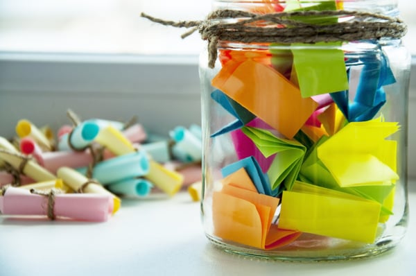 Glass jar filled with thank you notes