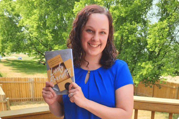 Meaghan at pc/nametag with Lucky Boxcutter Book