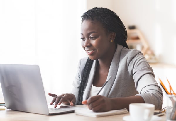 remote employee works on her laptop