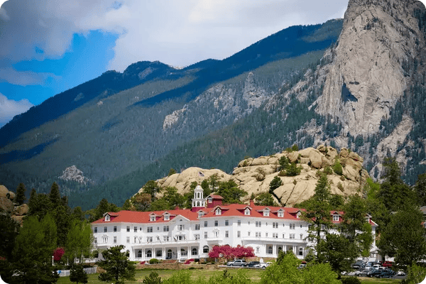 The Stanley Hotel with mountains in the background