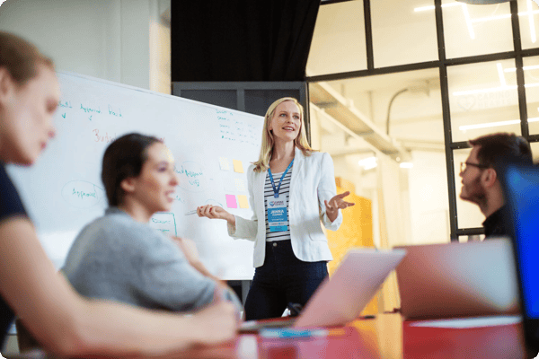 a team of event planners discusses a conference strategy in an office