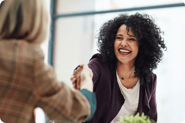 african american event planning professional shakes hands with a vendor