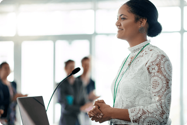 african american female keynote speaker presents at a conference