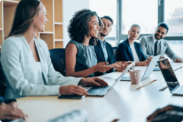 african american woman gives a presentation to her work team