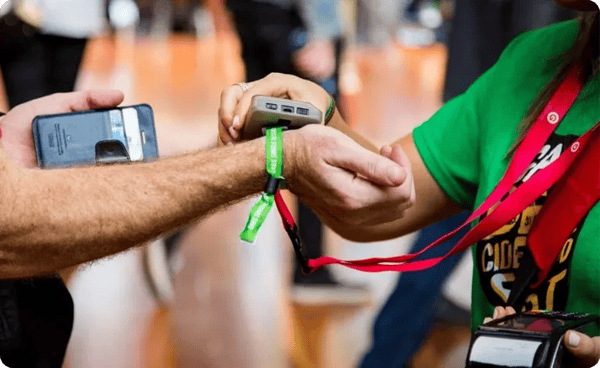 event staff scans an rfid wristband