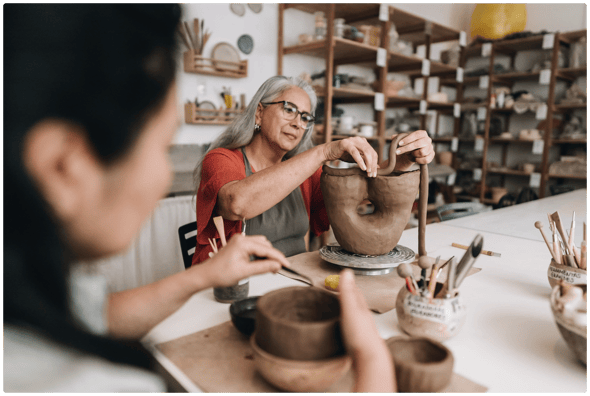 woman working on a clay art project