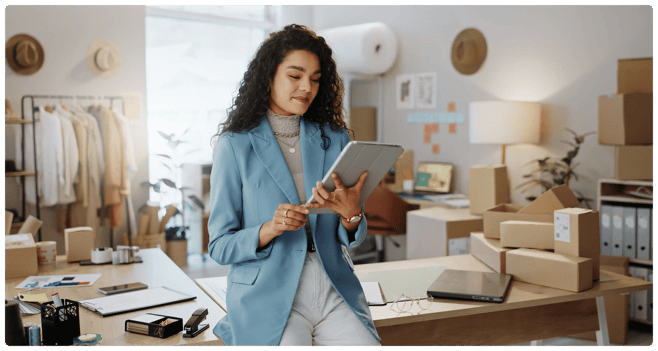 woman looking at her ipad in her office