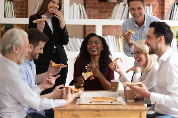 team members at pizza party