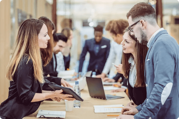 tradeshow exhibitor provides a demo to attendees