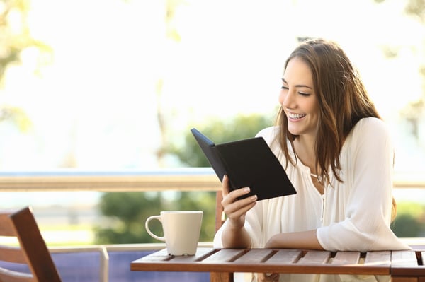 Woman reads a professional development book