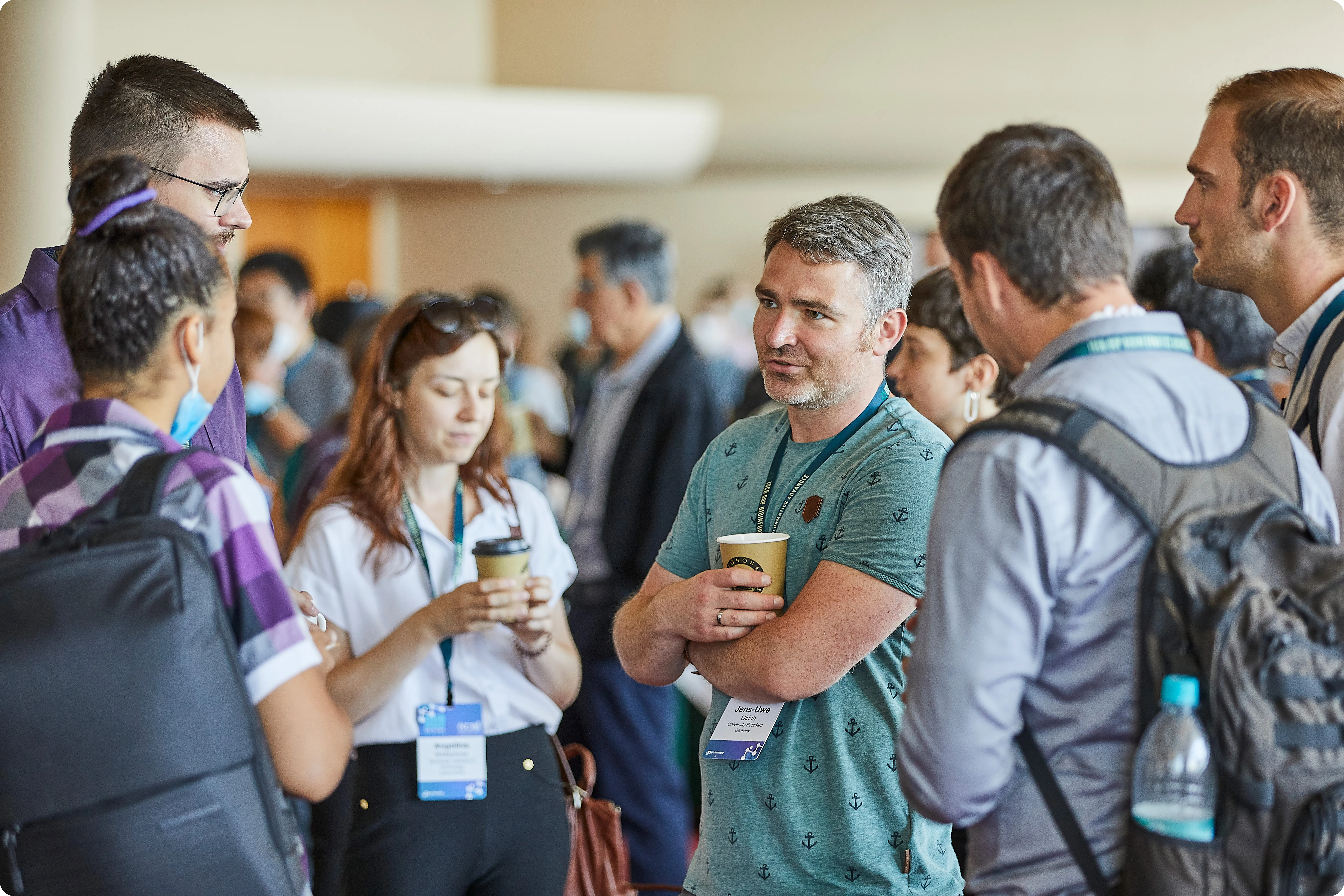 Attendees enjoy coffee at the ISMB 2022 conference