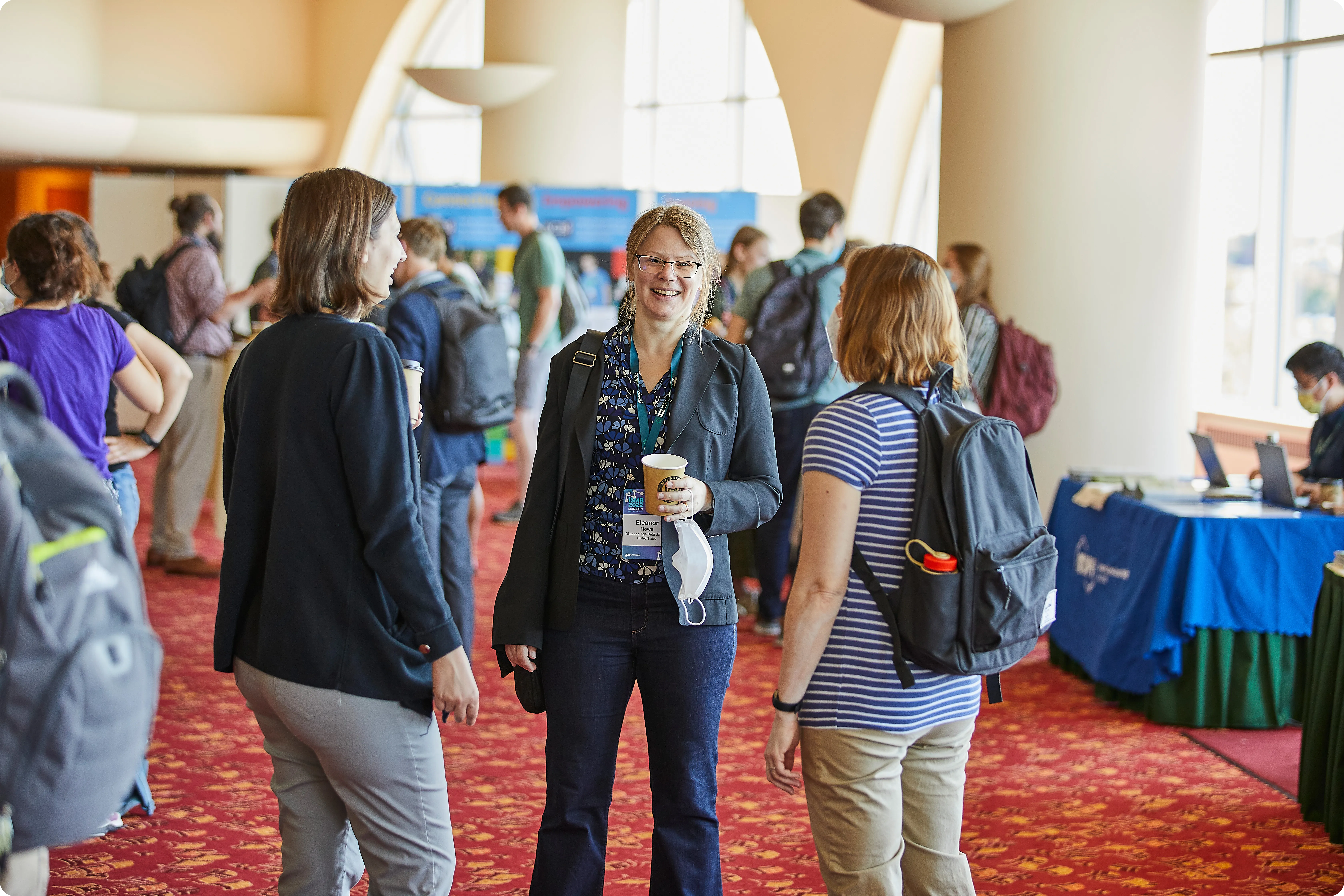 Attendees networking at the ISMB 2022 conference
