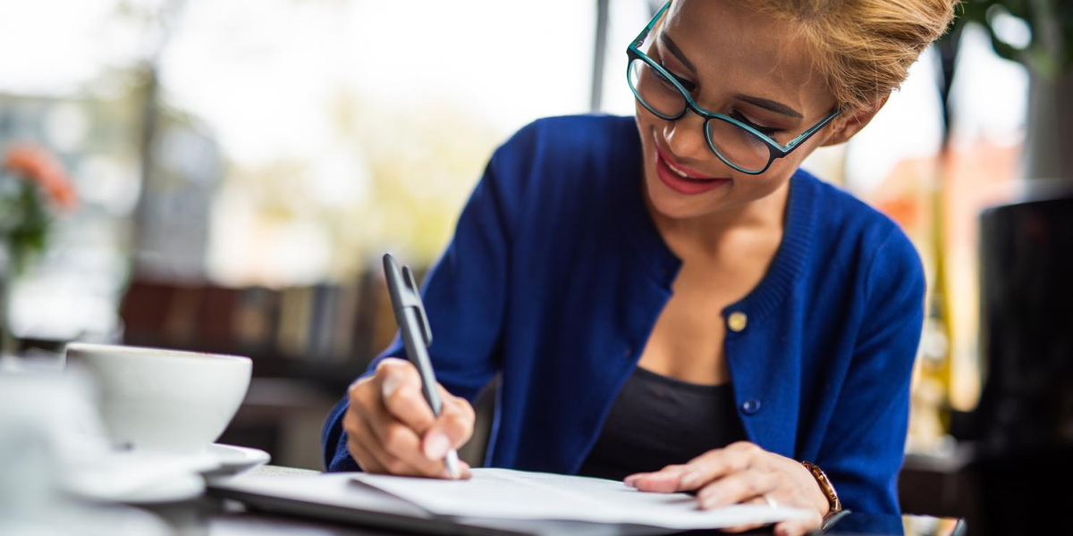 Woman signing sponsorship contract