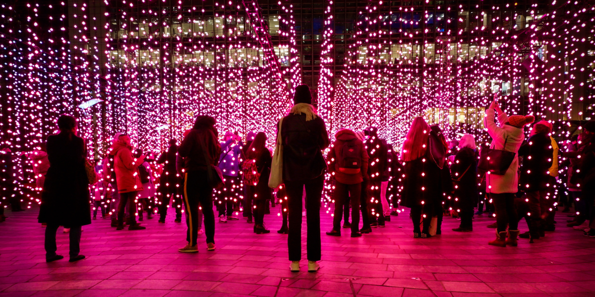 attendees participate in a nighttime lights experiential event