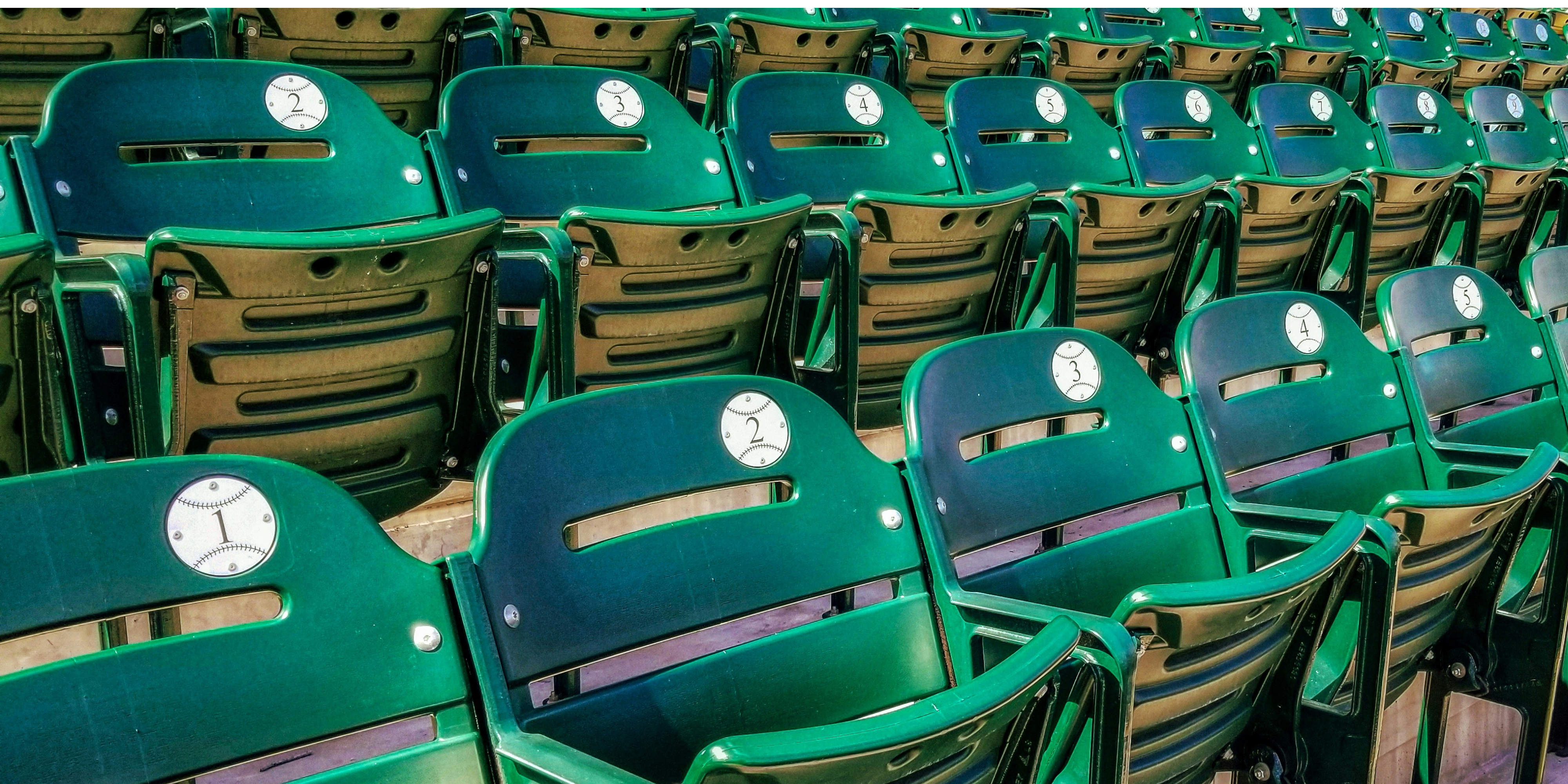 A close-up shot of green stadium seats