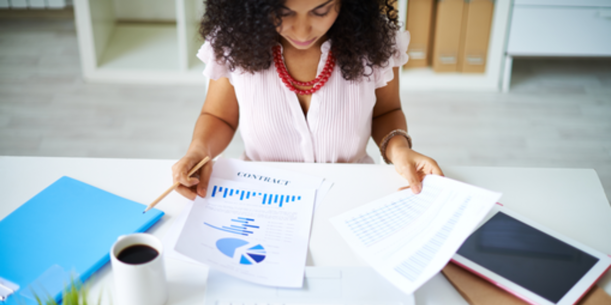 an association event planner checks a revenue report