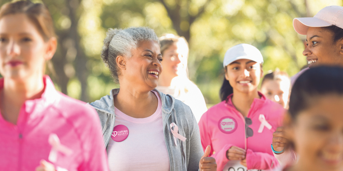 Women attend a charity event walk-a-thon to raise money for breast cancer
