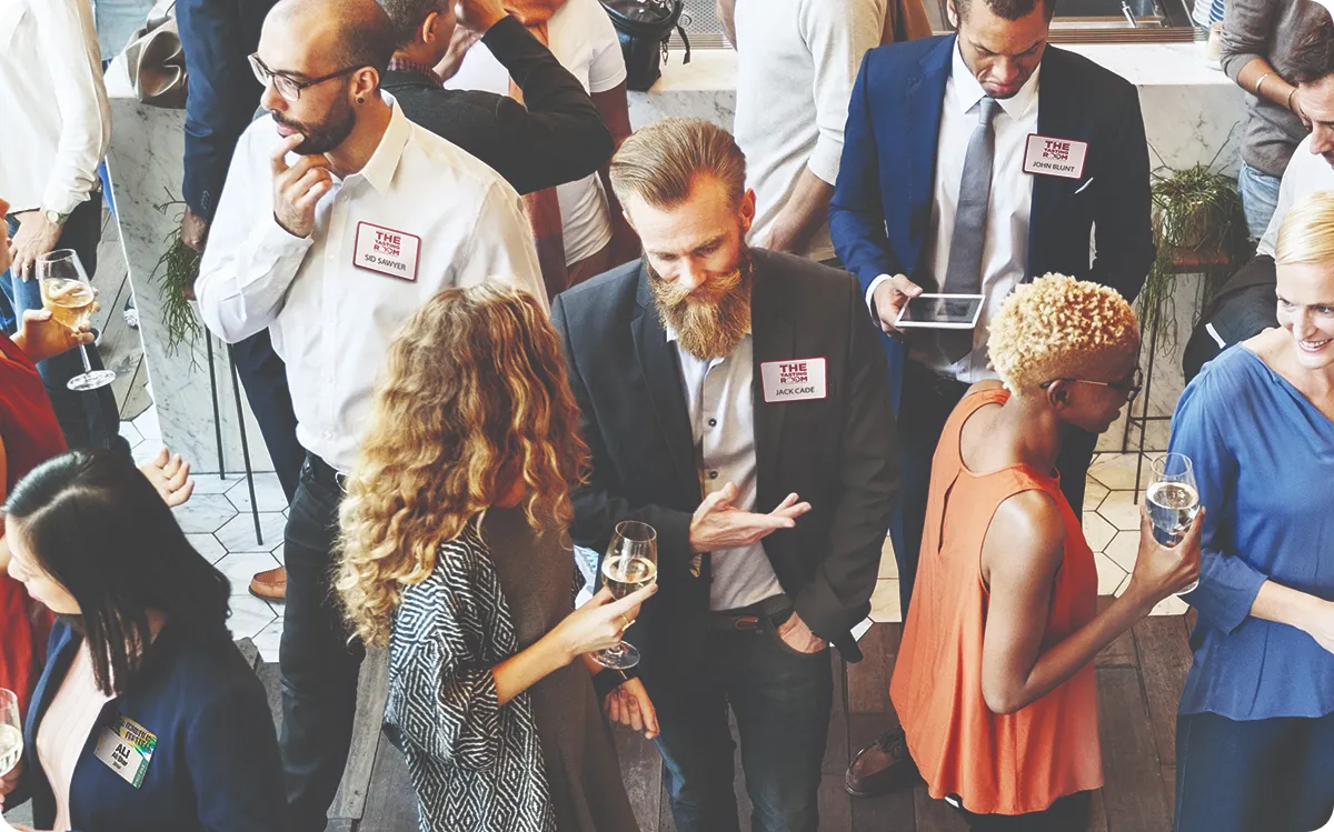 event attendees chat at a networking event